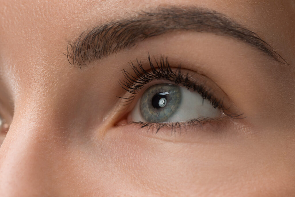 The close up eyes on face of young beautiful caucasian girl